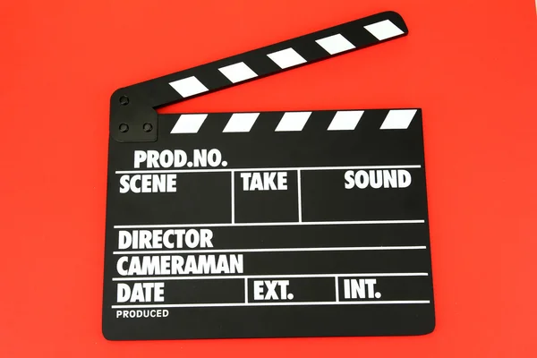 Movie production clapper board on color background — Stock Photo, Image