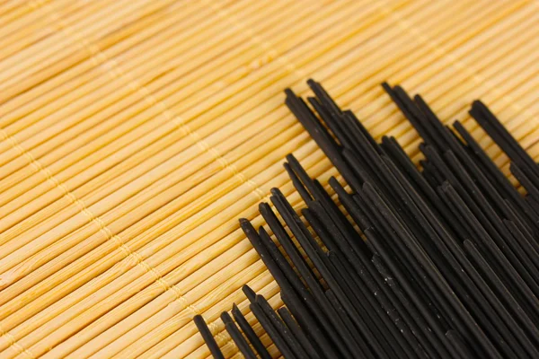 Black spaghetti on light background — Stock Photo, Image