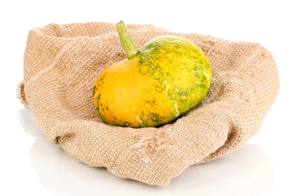 Pumpkin on sackcloth isolated on white — Stock Photo, Image