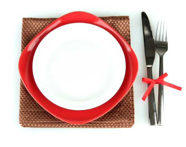 Empty red and white plates with fork and knife isolated on white — Stock Photo, Image