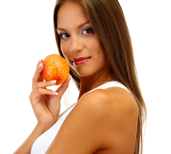 Beautiful young woman with peach, isolated on white — Stock Photo, Image