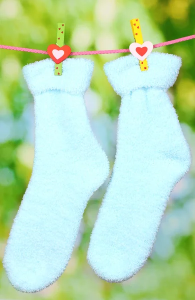 Pair of blue socks hanging to dry — Stock Photo, Image