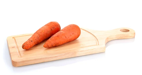 Carrots on wooden cutting board isolated on white — Stock Photo, Image