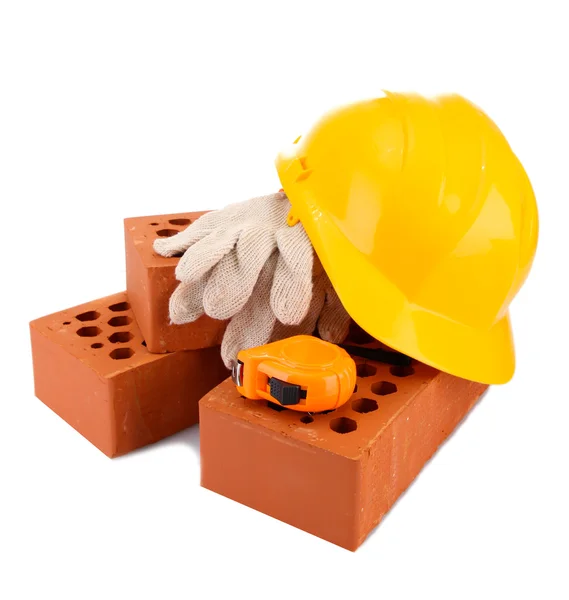 Helmet, roulette, bricks and gloves isolated on white — Stock Photo, Image