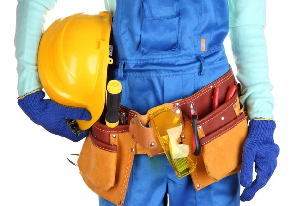 Construtor masculino em macacão azul com capacete amarelo isolado em branco — Fotografia de Stock