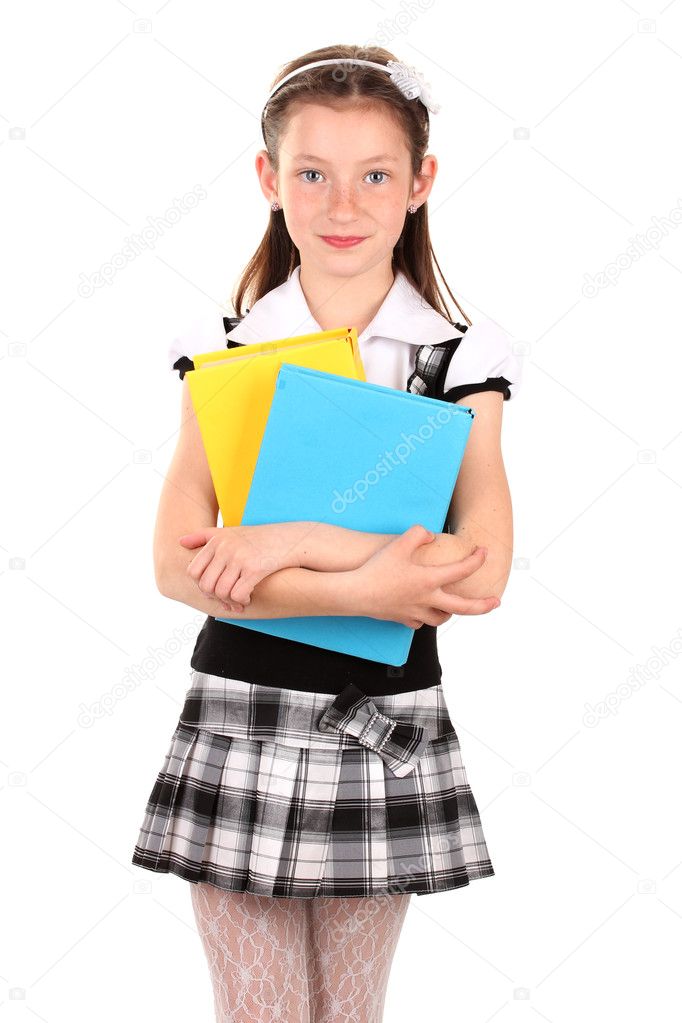 beautiful little girl in school uniform with books isolated on white