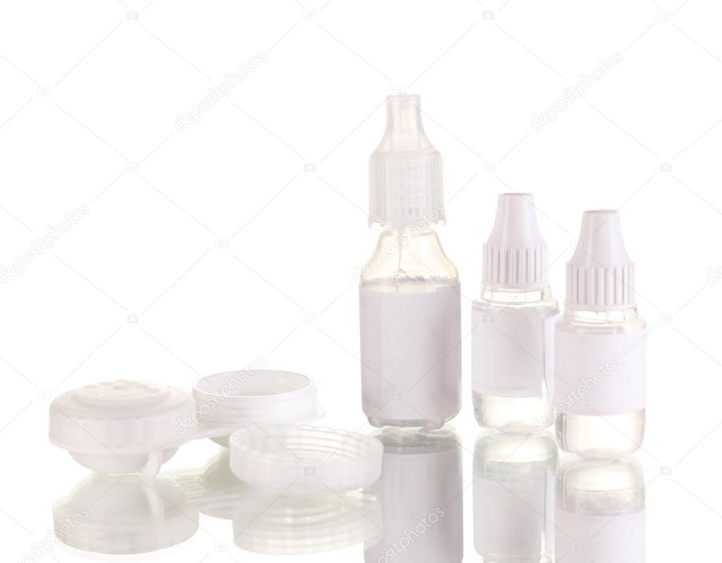 Eye drops and lenses isolated on white