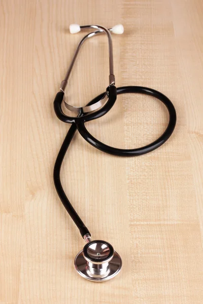 Stetoskop na bílý dřevěný stůl — Stock fotografie