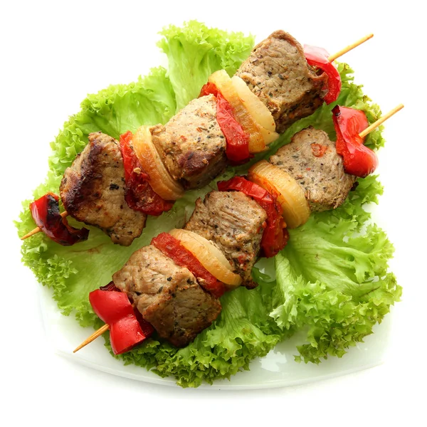 Tasty grilled meat and vegetables on skewers on plate, isoalted on white — Stock Photo, Image