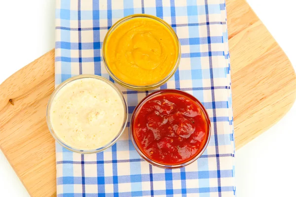 Various sauces on chopping board close-up — Stock Photo, Image