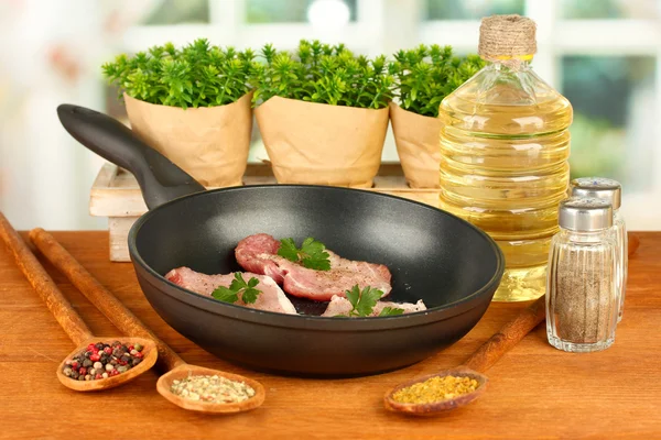 Composition of raw meat and spices on wooden table close-up — Stock Photo, Image