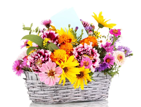 Beautiful bouquet of bright flowers in basket isolated on white — Stock Photo, Image