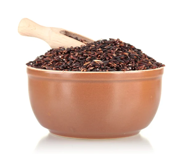 Black rice in a brown platewith a wooden scoop , isolated on white — Stock Photo, Image