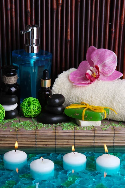 Beautiful spa setting near pool on bamboo background — Stock Photo, Image