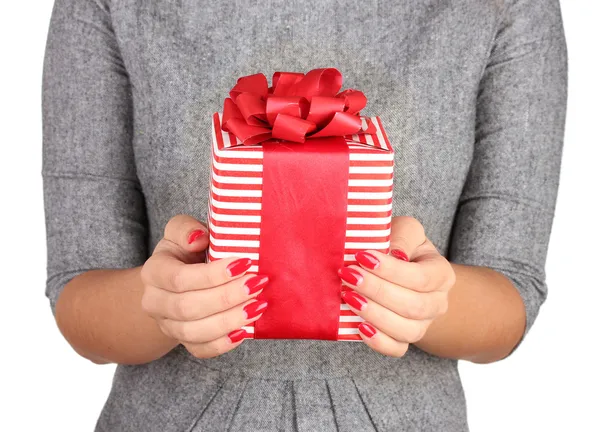 Woman holds box with gift on white background close-up — Stockfoto