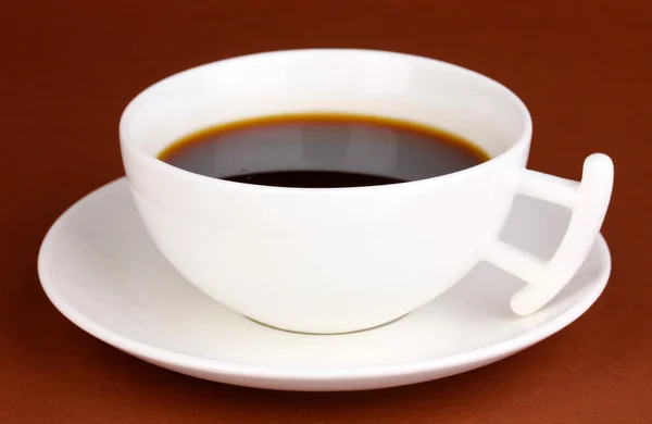 A cup of strong coffee on brown background — Stock Photo, Image