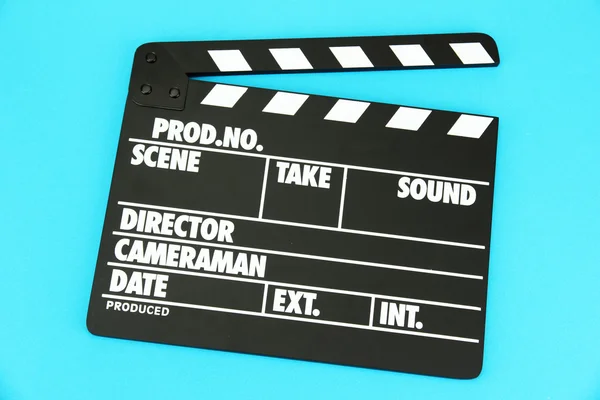 Movie production clapper board on color background — Stock Photo, Image