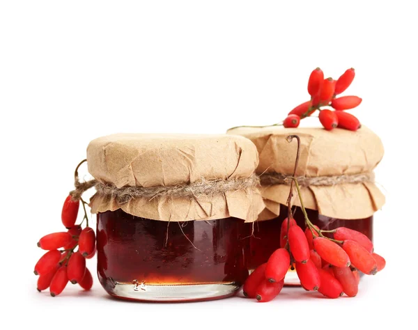 Ripe barberries and jars of jam isolated white — Stock Photo, Image