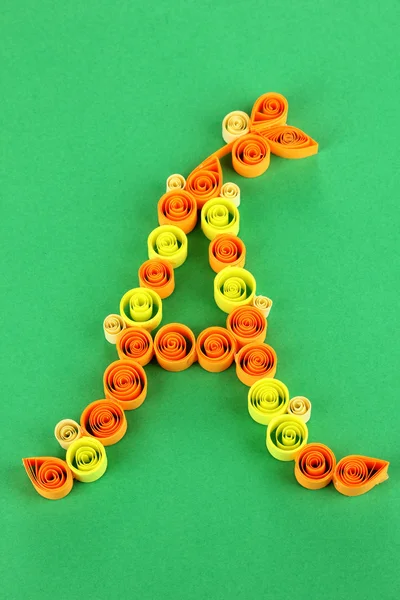 The letter A is made of quilling on green background — Stock Photo, Image