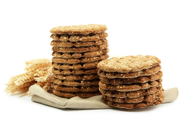 Saporito pane croccante e spighe, isolato su bianco — Foto Stock