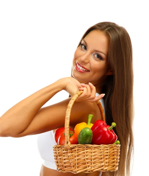 Beautiful young woman with vegetables in basket, isolated on white — Stock Photo, Image