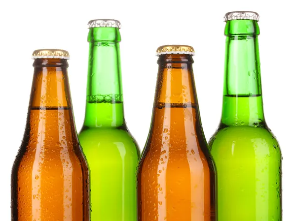 Bottiglie di birra in vetro colorato isolate su bianco — Foto Stock