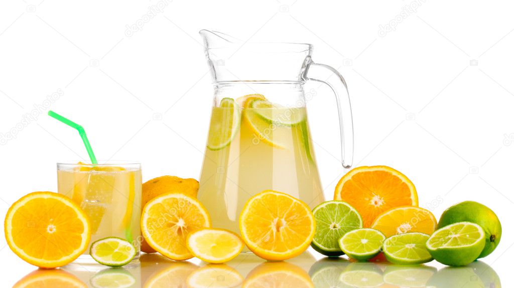 Citrus lemonade in pitcher and glass of citrus around isolated on white