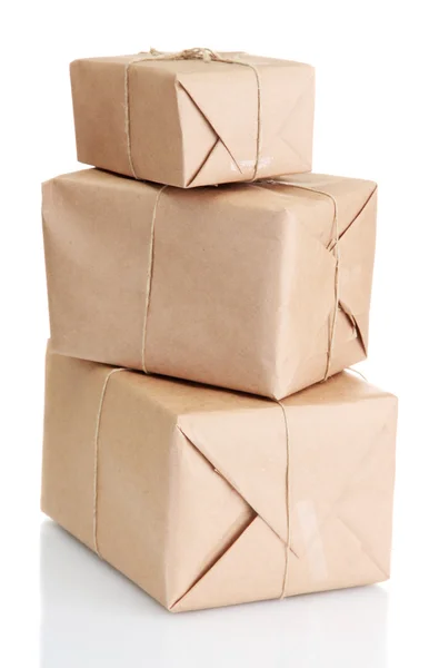 Parcels boxes with kraft paper, isolated on white — Stock Photo, Image