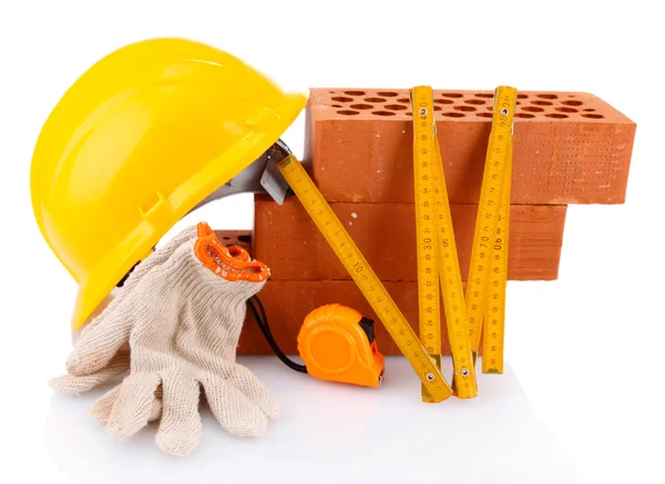 Helmet, roulette, bricks and gloves isolated on white — Stock Photo, Image