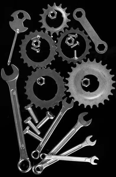 Machine gear, metal cogwheels, nuts and bolts isolated on black — Stock Photo, Image