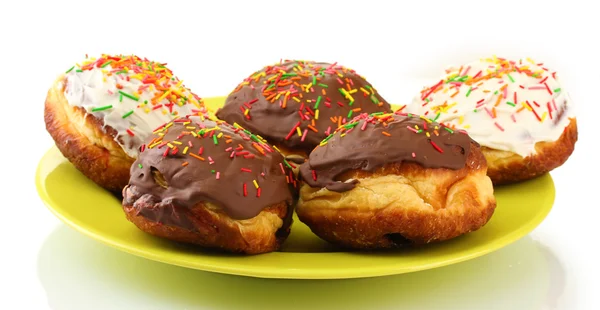 Sabrosas rosquillas en la placa de color aislado en blanco —  Fotos de Stock