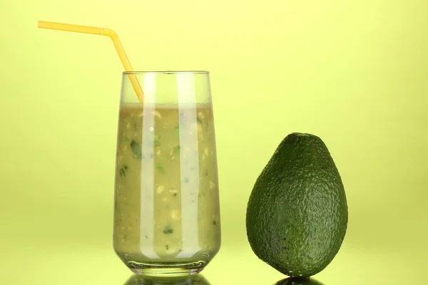 Useful fresh avocado on green background — Stock Photo, Image