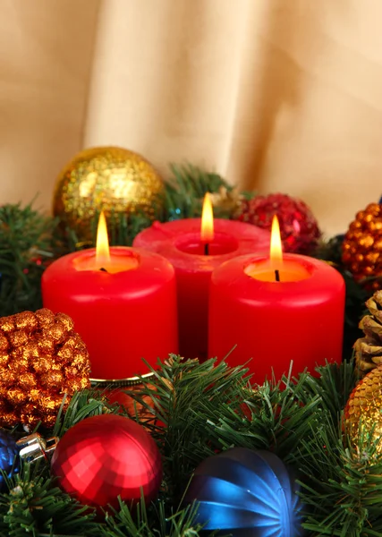 Beautiful Christmas wreath on gold fabric background Stock Image