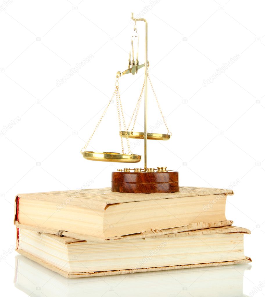 Gold scales of justice and books isolated on white