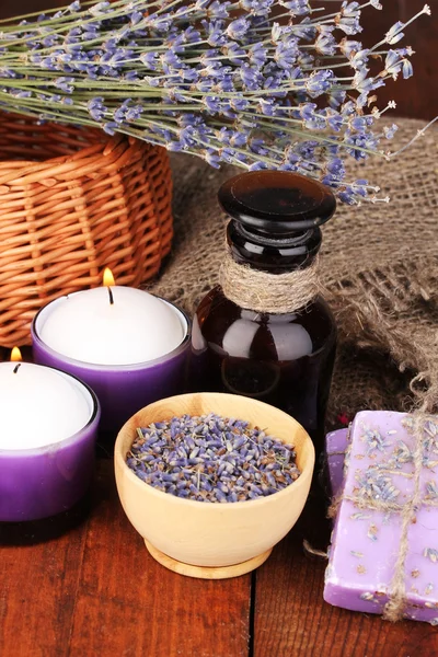 Flores y frasco de lavanda — Foto de Stock