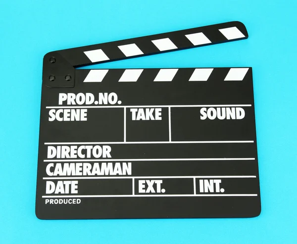 Movie production clapper board on color background — Stock Photo, Image