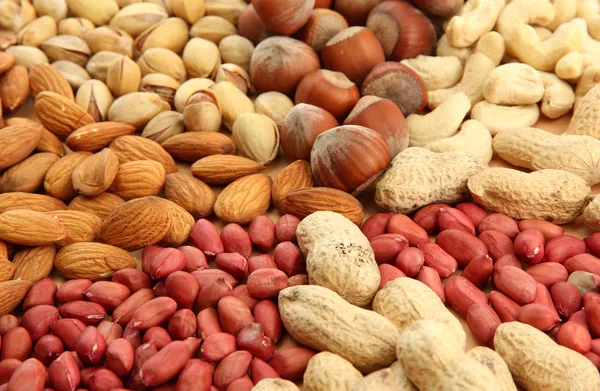 Surtido de frutos secos sabrosos, de cerca —  Fotos de Stock