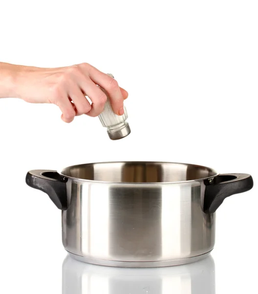 Hand adding salt using salt shaker isolated on white — Stock Photo, Image