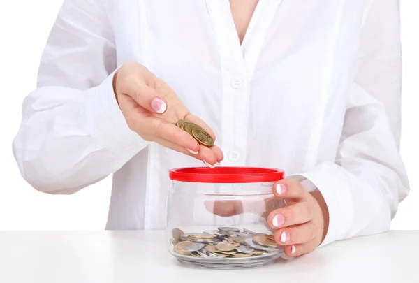Woman hands with coins in glass jar, close up — Stock Photo, Image