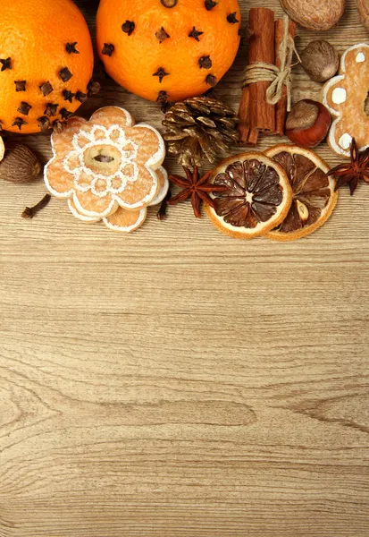 Composition of christmas spices and tangarines, on wooden background — Stock Photo, Image