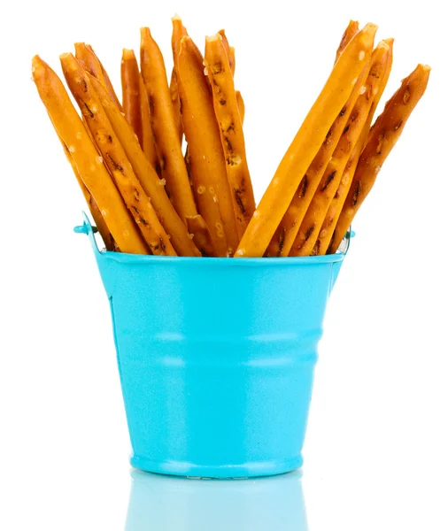 Tasty crispy sticks in blue pail isolated on white — Stock Photo, Image