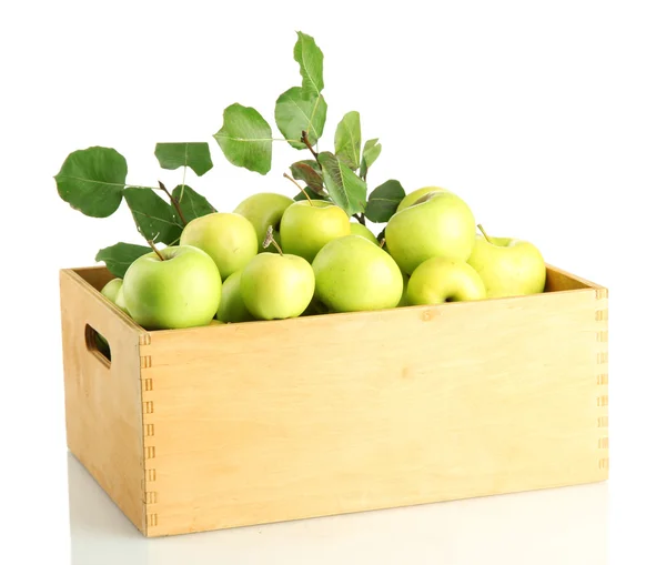 Juicy apples with green leaves in wooden crate, isolated on white — Stock Photo, Image