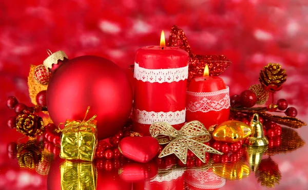 Red candle with christmas decoration on bright background — Stock Photo, Image