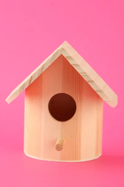 Nesting box on color background — Zdjęcie stockowe