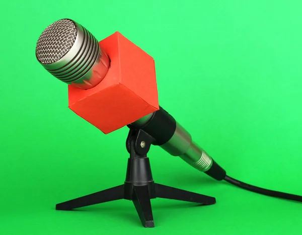Microphone on stand on green background — Stock Photo, Image