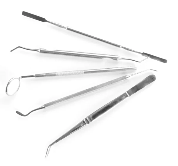 Ensemble d'outils dentaires pour le soin des dents isolé sur blanc — Photo