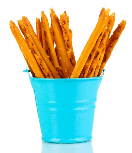 Tasty crispy sticks in blue pail isolated on white — Stock Photo, Image