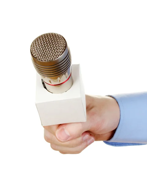 Main masculine avec microphone isolé sur blanc — Photo