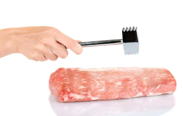Woman's hand beats pork on white background close-up — Stock Photo, Image