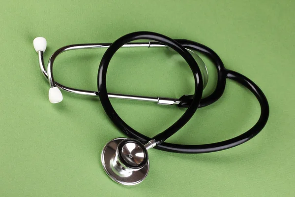 Stethoscope on green background — Stock Photo, Image